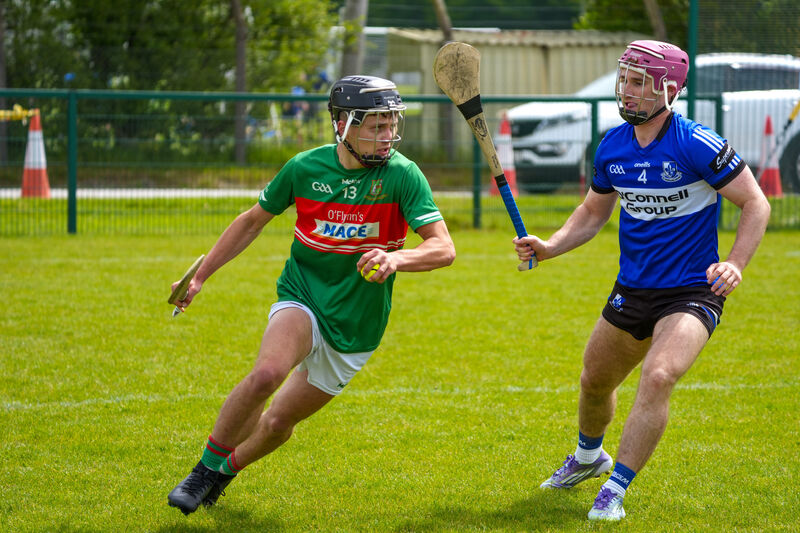 Tadhg O’Donoghue-Brosnan of Fr O’Neill's gets away from Sarsfields' Donal English. Picture: Noel Sweeney Tadhg O’Donoghue-Brosnan of Fr O’Neill's gets away from Sarsfields' Donal English. Picture: Noel Sweeney