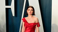 Eve Hewson says being raised by U2’s Bono took fame ‘off of a pedestal’