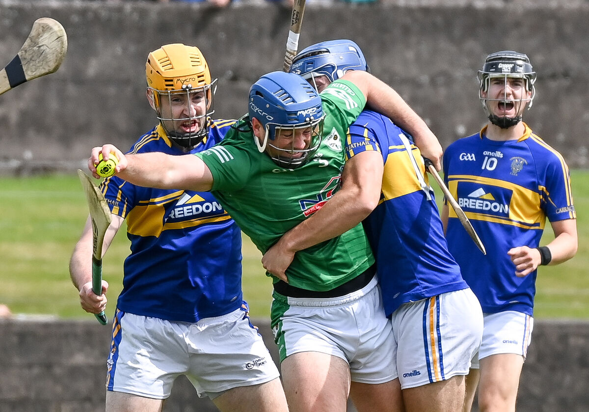Killeagh's Jamie Fogarty tries to get away from Carrigtwohill's Liam O'Sullivan and Sean Walsh during their SHL clash at Carrigtwohill. Killeagh's Jamie Fogarty tries to get away from Carrigtwohill's Liam O'Sullivan and Sean Walsh during their SHL clash at Carrigtwohill.