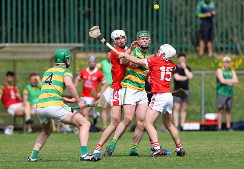 Cathal Cormack of Blackrock gets his handpass away towards his brother Diarmuid, under pressure from Charleville pair Tim Mawe and Garrett Gleeson. Picture: Jim Coughlan Cathal Cormack of Blackrock gets his handpass away towards his brother Diarmuid, under pressure from Charleville pair Tim Mawe and Garrett Gleeson. Picture: Jim Coughlan