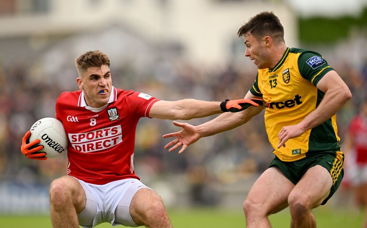 Ian Maguire of Cork in action against Conor O'Donnell of Donegal. Picture: Ramsey Cardy/Sportsfile Ian Maguire of Cork in action against Conor O'Donnell of Donegal. Picture: Ramsey Cardy/Sportsfile