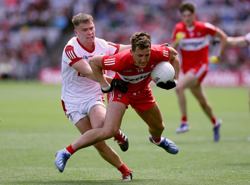 Derry's Shane McGuigan is tackled by Kevin O'Donovan of Cork. Picture: John McVitty/INPHO Derry's Shane McGuigan is tackled by Kevin O'Donovan of Cork. Picture: John McVitty/INPHO