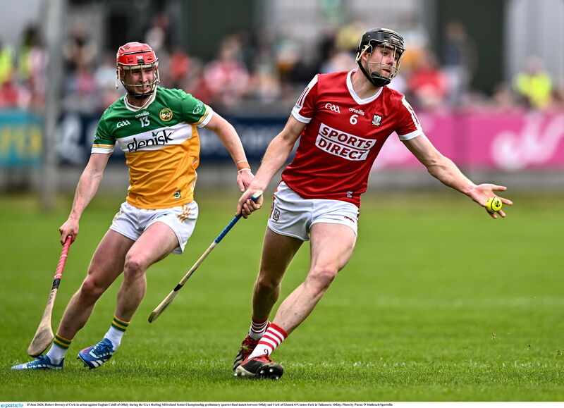 Cork's Robert Downey gets his pass away despite the attentions of Offaly's Eoghan Cahill during the All-Ireland SHC preliminary quarter-final at Glenisk O'Connor Park in Tullamore in 2024. Picture: Piaras Ó Mídheach/Sportsfile Cork's Robert Downey gets his pass away despite the attentions of Offaly's Eoghan Cahill during the All-Ireland SHC preliminary quarter-final at Glenisk O'Connor Park in Tullamore in 2024. Picture: Piaras Ó Mídheach/Sportsfile