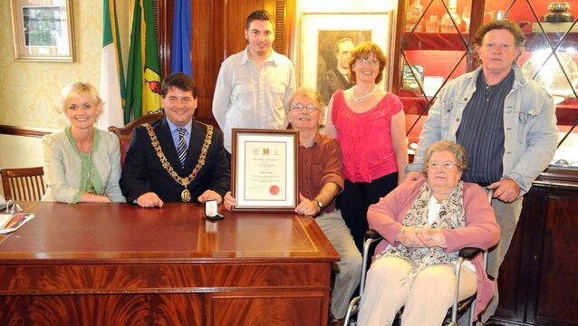 <p>Jimmy Crowley with a Lord Mayor’s civic award presented to him by Cllr Dara Murphy in 2010, along with members of his family - his mother Olive Crowley, sister Geraldine O’Sullivan, brother Darby, and his son James. BELOW: Jimmy with fellow Cork musician John Spillane in 2022, after a fund-raising concert for Ukraine. Picture: Eddie O'Hare</p> <p>Jimmy Crowley with a Lord Mayor’s civic award presented to him by Cllr Dara Murphy in 2010, along with members of his family - his mother Olive Crowley, sister Geraldine O’Sullivan, brother Darby, and his son James. BELOW: Jimmy with fellow Cork musician John Spillane in 2022, after a fund-raising concert for Ukraine. Picture: Eddie O'Hare</p>