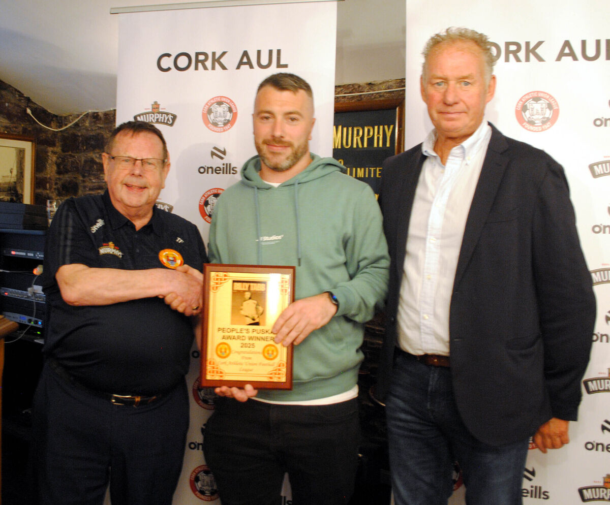 Tom Fitzgerald (Cork AUL) presents a special award to Billy Tabb in recognition for his achievement as the People's Puskas Award winner recently. Tom Fitzgerald (Cork AUL) presents a special award to Billy Tabb in recognition for his achievement as the People's Puskas Award winner recently.