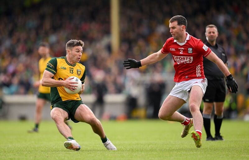 Conor O'Donnell of Donegal in action against Maurice Shanley of Cork. Picture: Ramsey Cardy/Sportsfile