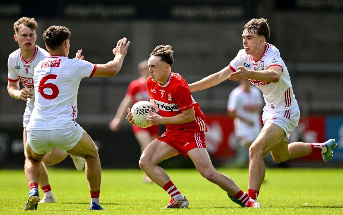 Lorcan Higgins of Derry in action against Conor Downing, left and Darragh O'Sullivan of Cork. Picture: Sam Barnes/Sportsfile