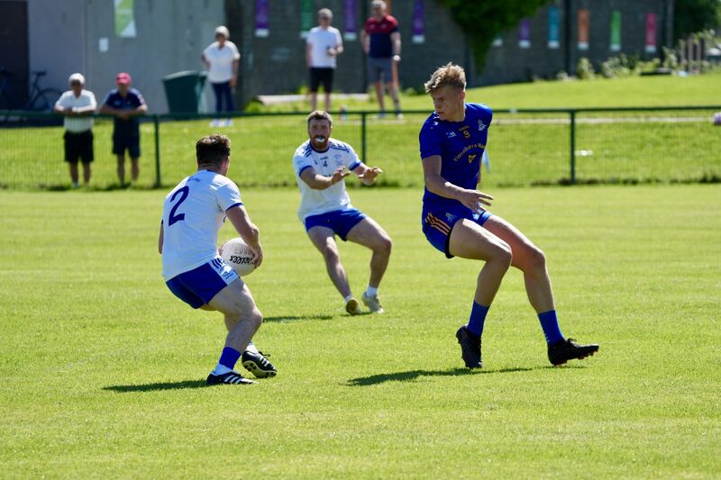 Cill Na Martra's Danny Ó Conaill finds support in teammate Caine Ó Forréidh as St Finbarr's Thomas Egan closes in. Picture by Noel Sweeney Cill Na Martra's Danny Ó Conaill finds support in teammate Caine Ó Forréidh as St Finbarr's Thomas Egan closes in. Picture by Noel Sweeney