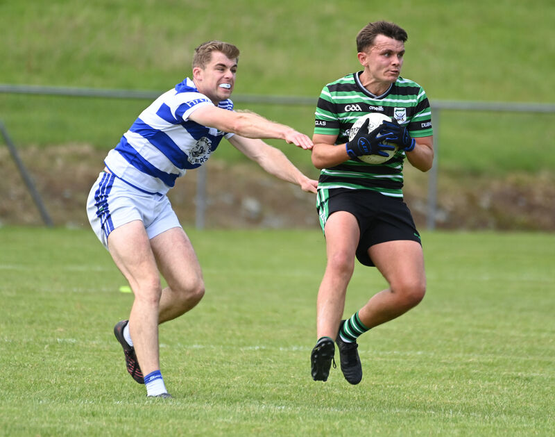 Douglas' Brendan Powter wins the ball from Castlehaven's Andrew Whelton. Picture: Eddie O'Hare Douglas' Brendan Powter wins the ball from Castlehaven's Andrew Whelton. Picture: Eddie O'Hare