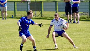 <p>St Finbarr’s James Murray closes in on Ciarán Ó Duinnín of Cill na Martra. Picture by Noel Sweeney</p> <p>St Finbarr’s James Murray closes in on Ciarán Ó Duinnín of Cill na Martra. Picture by Noel Sweeney</p>