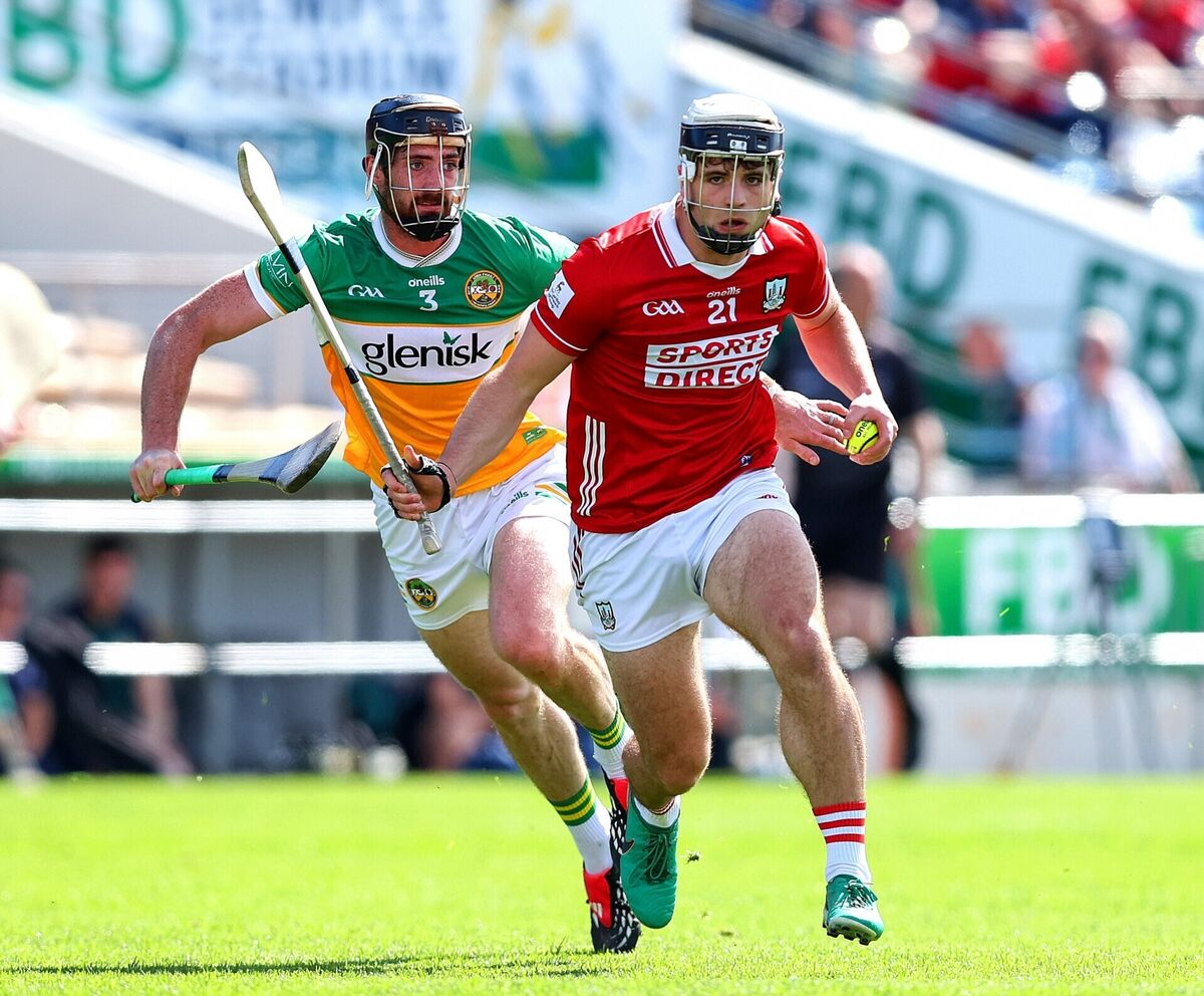 Cork's Barry Walsh gets away from Ben Conneely of Offaly. Picture: Inpho/Tom O'Hanlon