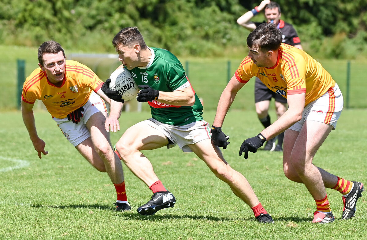  Clonakilty's Sean McEvoy races past John Mullins and Mark Kelleher of Eire Og during their SFL clash in Ovens.