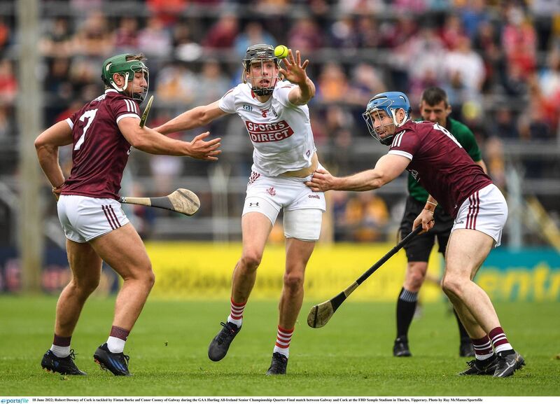 Robert Downey of Cork, in white, is tackled by Fintan Burke and Conor Cooney of Galway during the 2022 All-Ireland SHC quarter-final at FBD Semple Stadium in Thurles. Picture: Ray McManus/Sportsfile Robert Downey of Cork, in white, is tackled by Fintan Burke and Conor Cooney of Galway during the 2022 All-Ireland SHC quarter-final at FBD Semple Stadium in Thurles. Picture: Ray McManus/Sportsfile