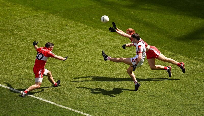 Chris Óg Jones of Cork in action against Benny Heron and Conor Glass of Derry in 2023. Picture: Brendan Moran/Sportsfile