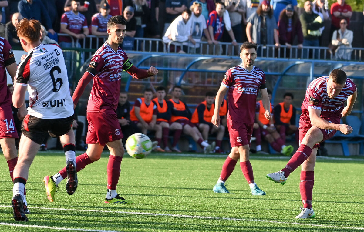  Cobh Ramblers' Jason Abbott shoots past Dundalk's Aodh Dervin, during their SSE Airtricity League Division 1 clash at St Colman's Park.