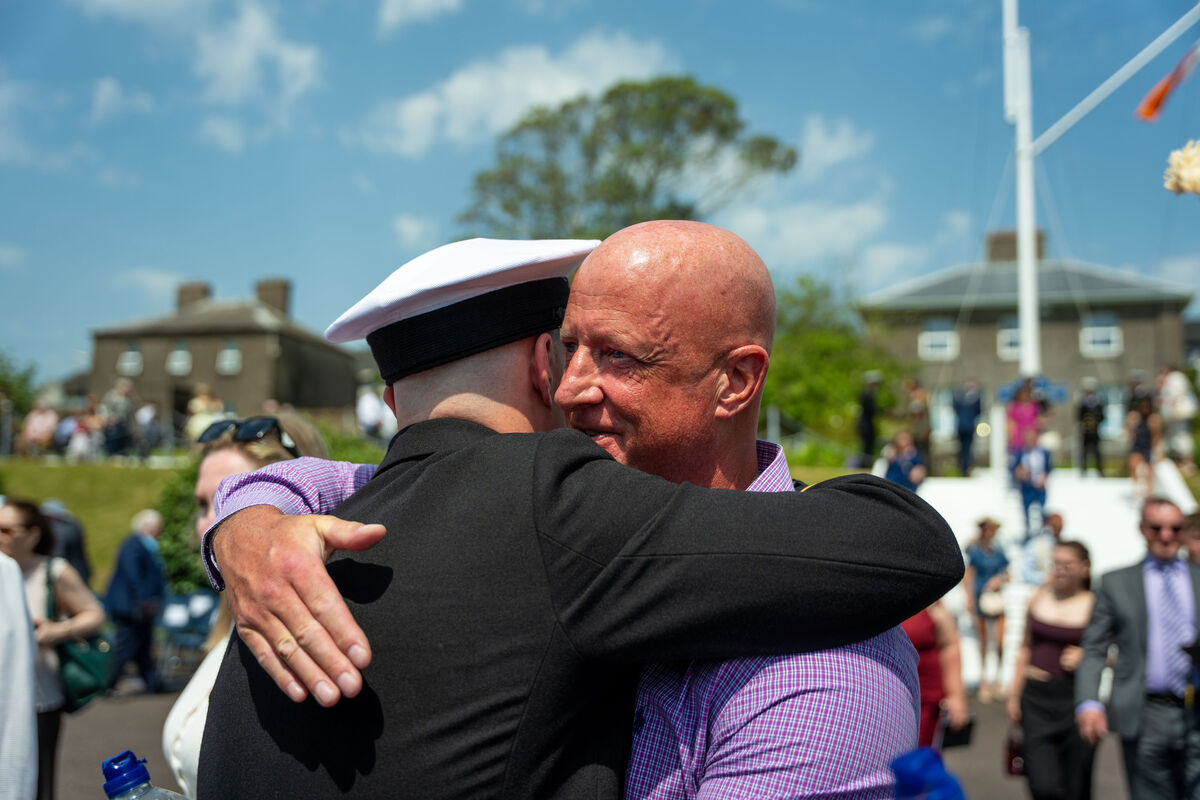 Naval graduate Ensign Jack McDonough-Elwood is hugged by his father Graham Elwood.. Picture Noel Sweeney Naval graduate Ensign Jack McDonough-Elwood is hugged by his father Graham Elwood.. Picture Noel Sweeney