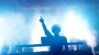 Club, disco DJ playing and mixing music for people. Nightlife