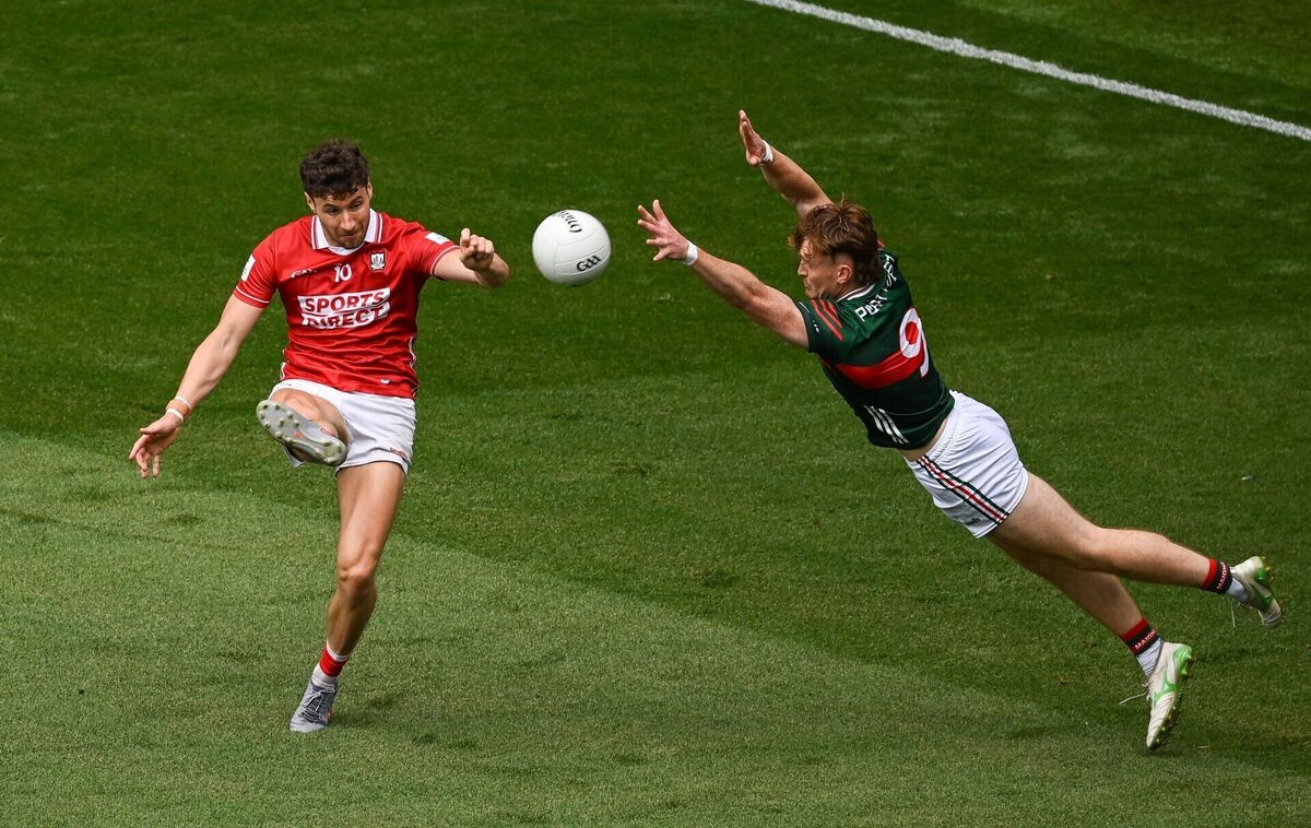 Paul Walsh of Cork scores a point despite the efforts of Jack Carney of Mayo. Picture: Sam Barnes/Sportsfile Paul Walsh of Cork scores a point despite the efforts of Jack Carney of Mayo. Picture: Sam Barnes/Sportsfile