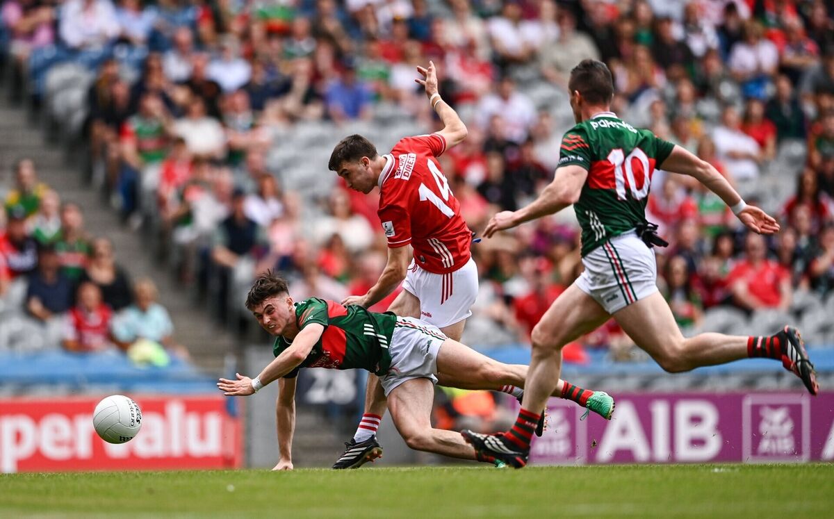 Chris Óg Jones of Cork has a shot on goal despite the attention of Eoin McGreal of Mayo. Picture: Ben McShane/Sportsfile Chris Óg Jones of Cork has a shot on goal despite the attention of Eoin McGreal of Mayo. Picture: Ben McShane/Sportsfile