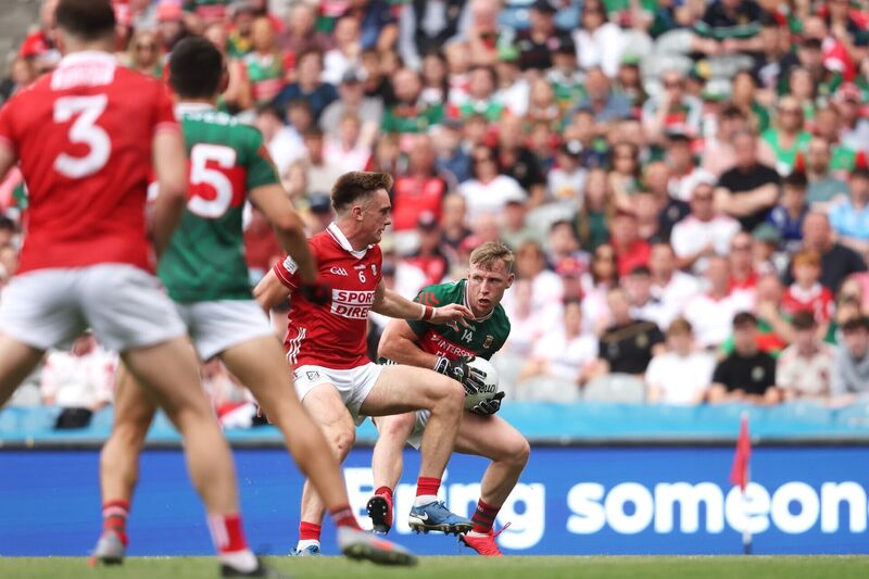 Cork's Tommy Walsh and Ryan O’Donoghue of Mayo battle for the ball. Picture: Bryan Keane/INPHO