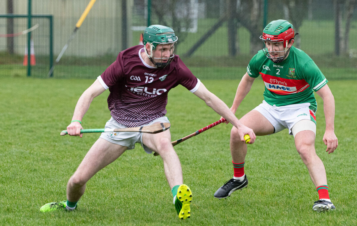 Killeagh's David Buckley keeps the sliotar away from Fr O'Neill's Michael Millerick during their Division 1 HL match in Aghavine. Picture: Howard Crowdy