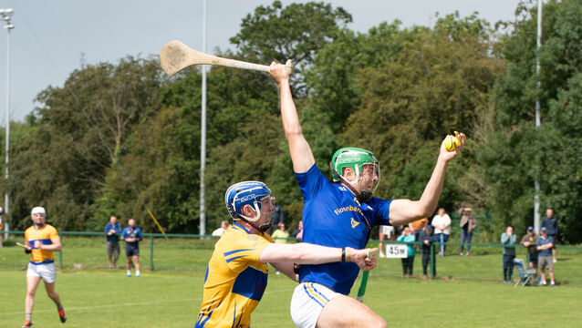 <p>St Finbarr's Ben Cunningham catches the sliothar ahead of Carrigtwohill's Sean de Burca. Picture: Howard Crowdy</p>