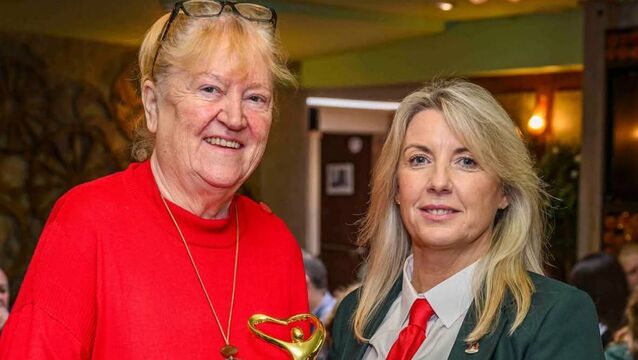 <p>Catriona Twomey makes a presentation to Cork County Boxing Board register Louise Forde.</p>