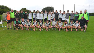 <p>Douglas captain Emmett Cronin, players and mentors celebrate the win over Nemo Rangers in the Rebel Óg under 16 Premier 1 football league final at Shanbally. Picture: Eddie O'Hare</p>