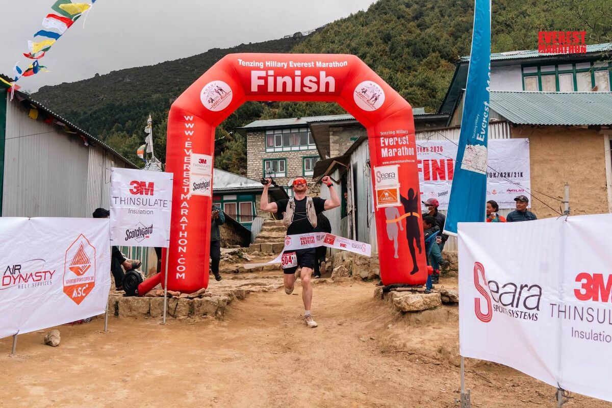 Brian crossing the finish line. Brian crossing the finish line.