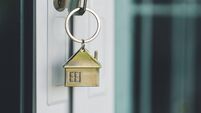 House model and key in house door. Real estate agent offer house, property insurance and security, affordable housing concepts