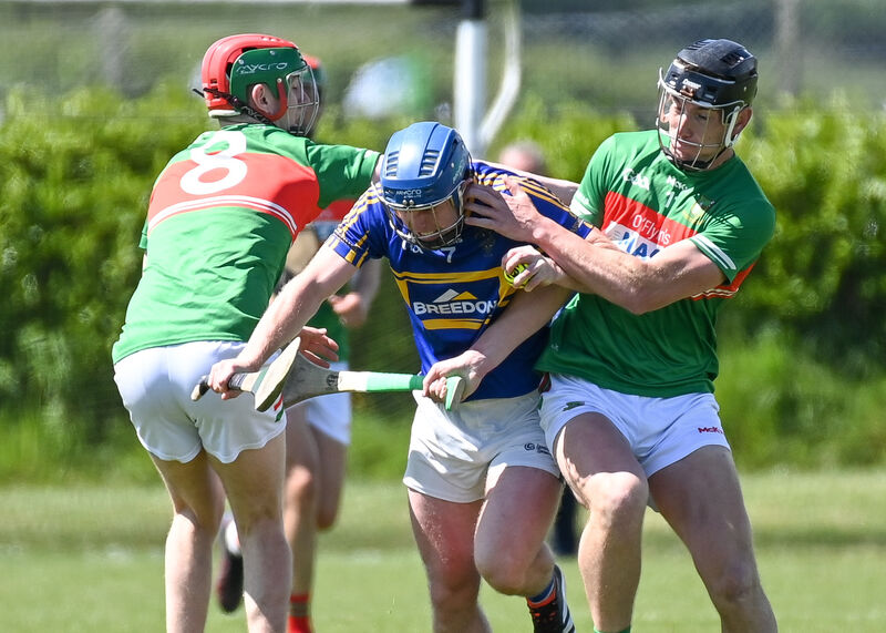 Fr O'Neill's Kevin O'Sullivan and John Millerick tackle Carrigtwohill's Jay Horgan, during their SHL clash at Aghavine. Picture: David Keane Fr O'Neill's Kevin O'Sullivan and John Millerick tackle Carrigtwohill's Jay Horgan, during their SHL clash at Aghavine. Picture: David Keane