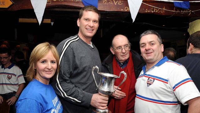 <p>Collette O'Leary, Doug Leichner (coach), Mick O'Sullivan and Michael O'Leary celebrating UCC Demons victory in the Men's National Basketball cup at the Joshua Tree Bar.</p>