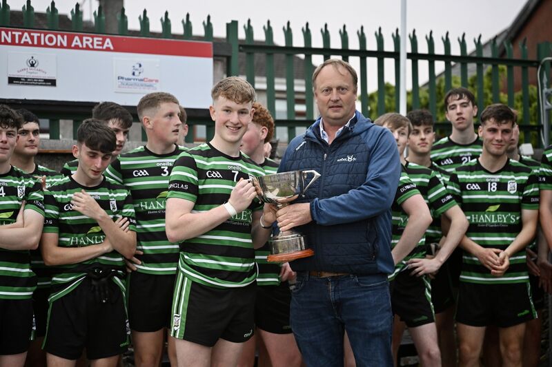 Celebrations for Douglas, captained by James Gordon, as he is presented with the cup by Peter Watson of Rebel Og after the win in the Rebel Og Fe18 Premier 1 League Football final: Douglas vs Carrigaline at Ballinlough, Cork. Picture: Larry Cummins Celebrations for Douglas, captained by James Gordon, as he is presented with the cup by Peter Watson of Rebel Og after the win in the Rebel Og Fe18 Premier 1 League Football final: Douglas vs Carrigaline at Ballinlough, Cork. Picture: Larry Cummins