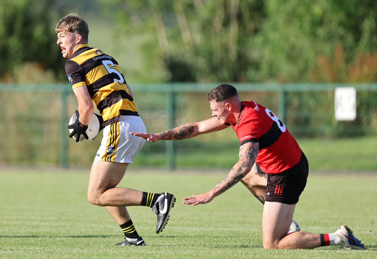  Sean Walsh, Mitchelstown, tackles Eoin McNabola, Canovee.