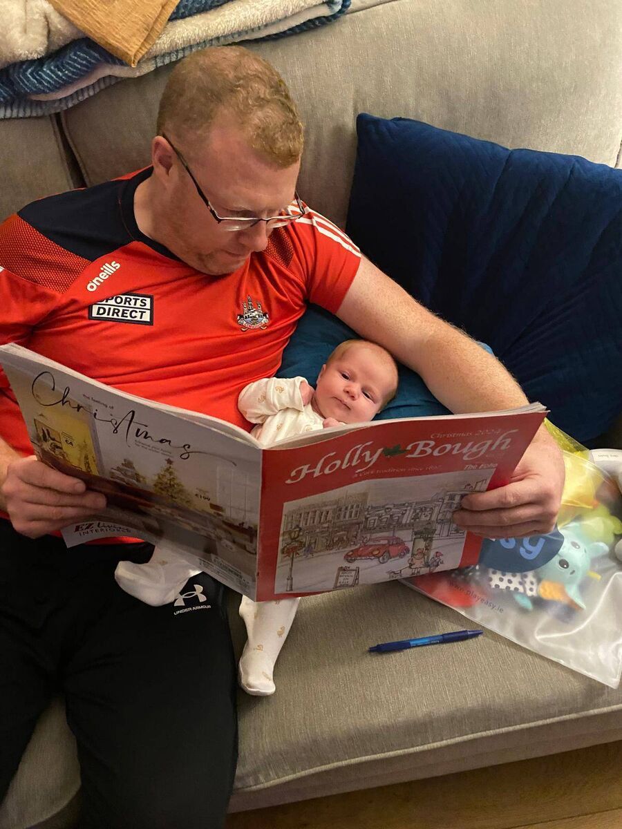 Chris Bowles and daughter Abbie Bowles reading last year's Holly Bough. Chris Bowles and daughter Abbie Bowles reading last year's Holly Bough.