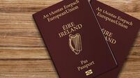 An Irish passport gives citizens of Ireland, a top view of passports on a wooden table