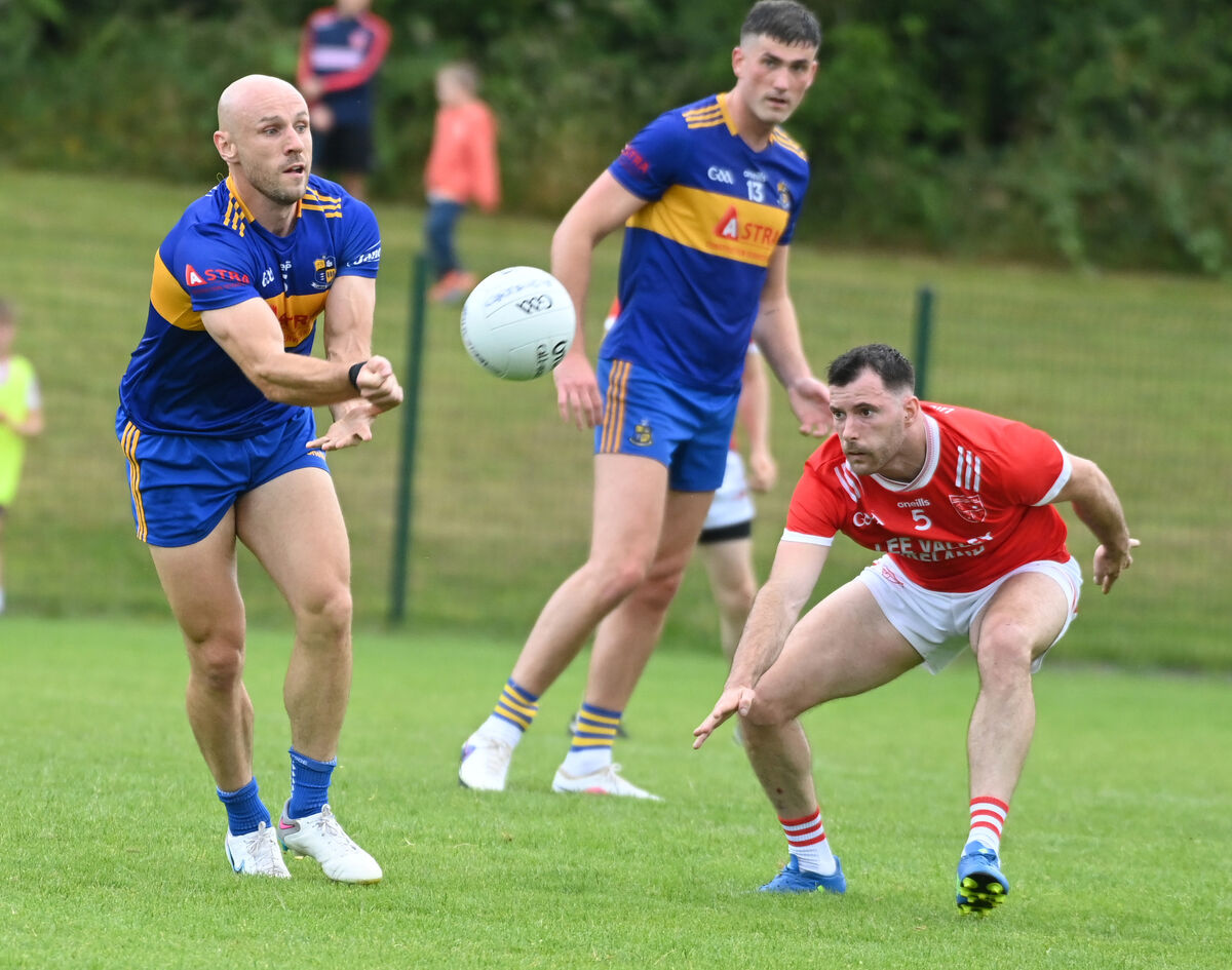 Carrigaline's Brian O'Driscoll lays off the ball from Uibh Laoire's Kevin Manning. Picture: Eddie O'Hare