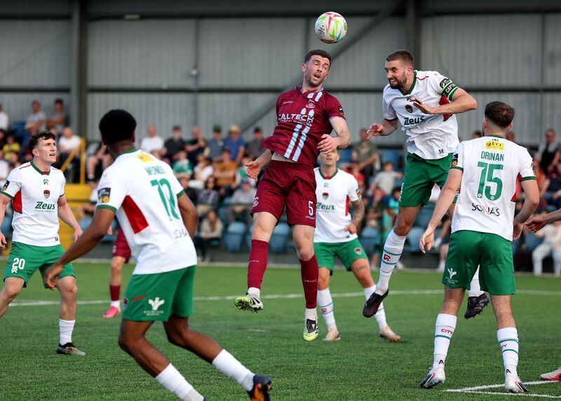  Breandan Frahill, Cobh Ramblers, and Fiacre Kelleher, Cork City FC, battle for the high ball. Picture: Jim Coughlan.
