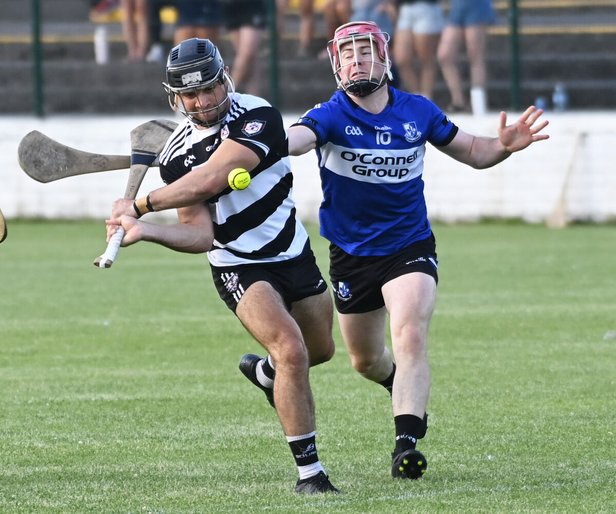 Midleton's Mikey Finn shoots from despite the attentions of Sarsfields' Daniel Kearney. Picture: Eddie O'Hare Midleton's Mikey Finn shoots from despite the attentions of Sarsfields' Daniel Kearney. Picture: Eddie O'Hare