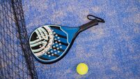 Close up padel or tennis racket and balls