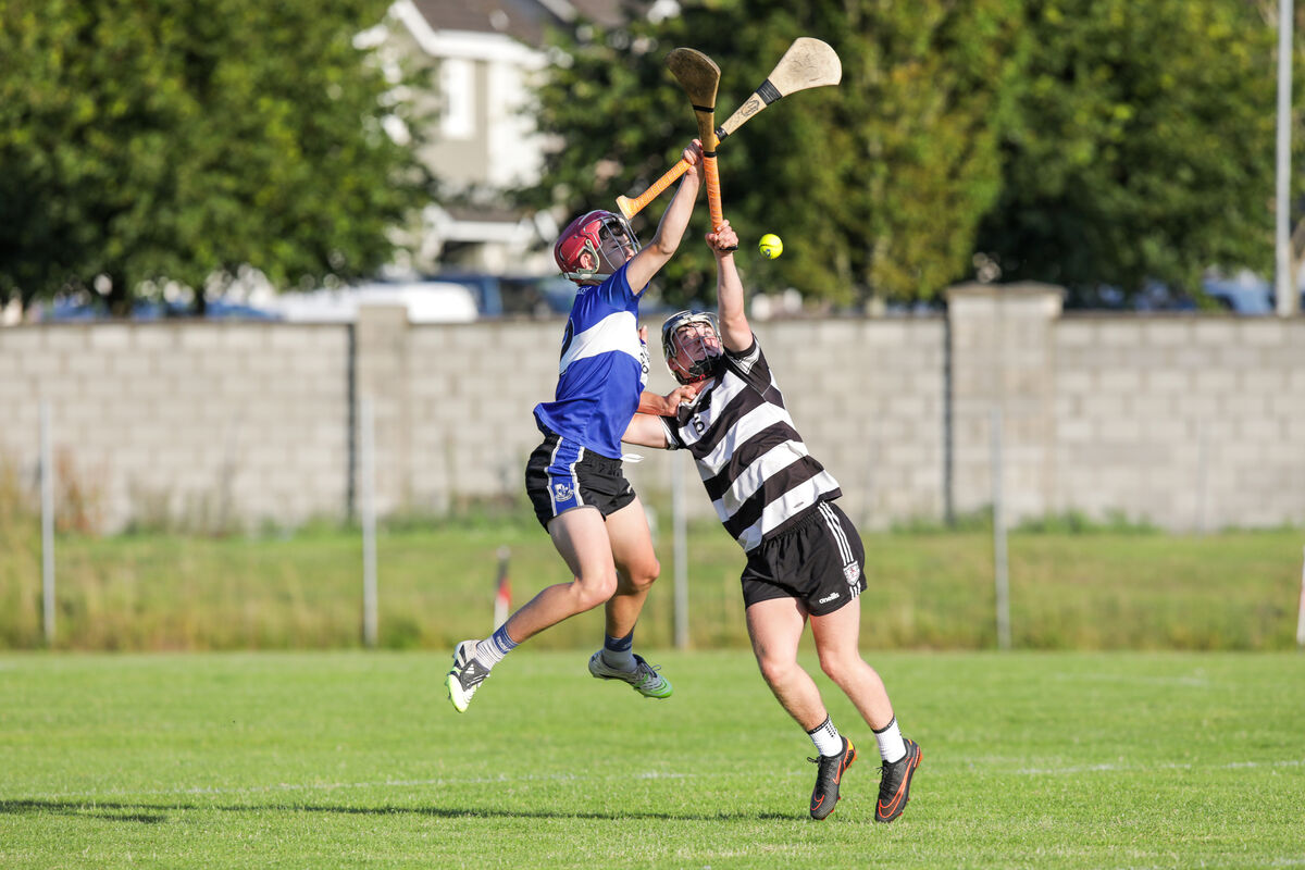 Seán Carey of Sarsfields and Midleton's John O'Sullivan contest aerial possession. Picture: David Creedon Seán Carey of Sarsfields and Midleton's John O'Sullivan contest aerial possession. Picture: David Creedon