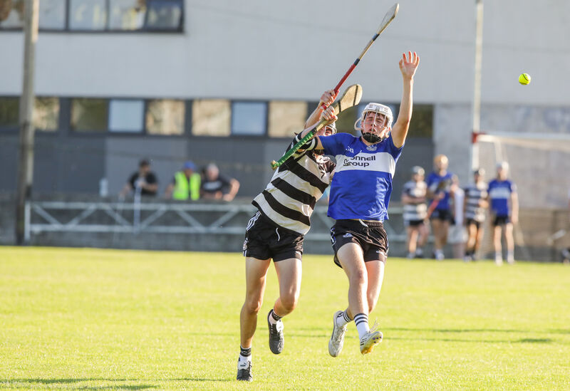 Cian Hogan of Midleton and Sarsfields' Tom Hurley contest possession in the air. Picture: David Creedon Cian Hogan of Midleton and Sarsfields' Tom Hurley contest possession in the air. Picture: David Creedon