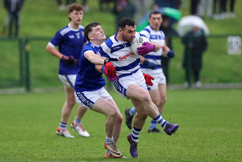 Donagh O'Riordan of Aghinagh tackles Liam Ryan of Inniscarra. Picture: Jim Coughlan Donagh O'Riordan of Aghinagh tackles Liam Ryan of Inniscarra. Picture: Jim Coughlan