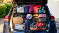 Car holiday iStock-2240419624.jpg The trunk of a car fully packed for a family summer holiday adventure