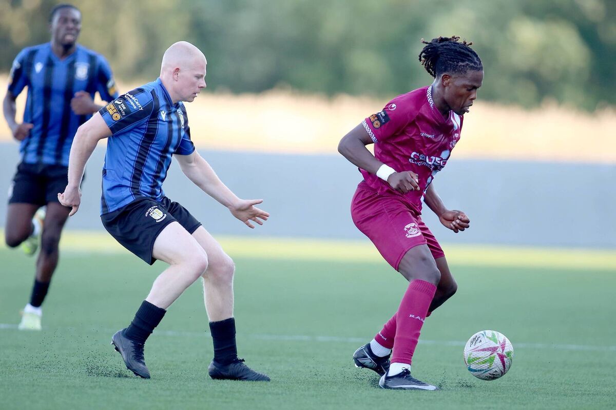Wilson Waweru, Cobh Ramblers, holds off Aaron Connolly, Athlone Town. Picture: Paul Molloy. 