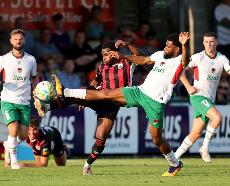 Hans Mpongo battles Sultan Adenekan, Longford Town. Picture: Jim Coughlan. Hans Mpongo battles Sultan Adenekan, Longford Town. Picture: Jim Coughlan.