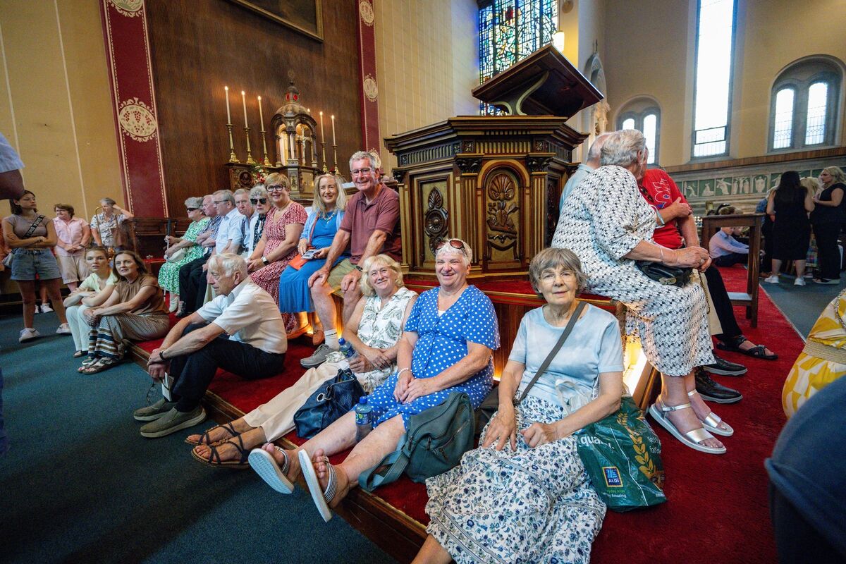 Parishioners find every available space to sit as soaring temperatures and huge crowds fill St Augustine’s Church for its final Mass. Picture: Chani Anderson