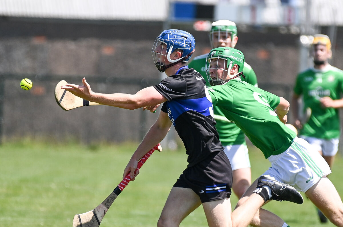 Sarsfields' Sam McNamara gets his pass away under pressure from Aghada's Ronan Murphy during their Division 6 Hurling League final in Cobh. Picture: David Keane. Sarsfields' Sam McNamara gets his pass away under pressure from Aghada's Ronan Murphy during their Division 6 Hurling League final in Cobh. Picture: David Keane.