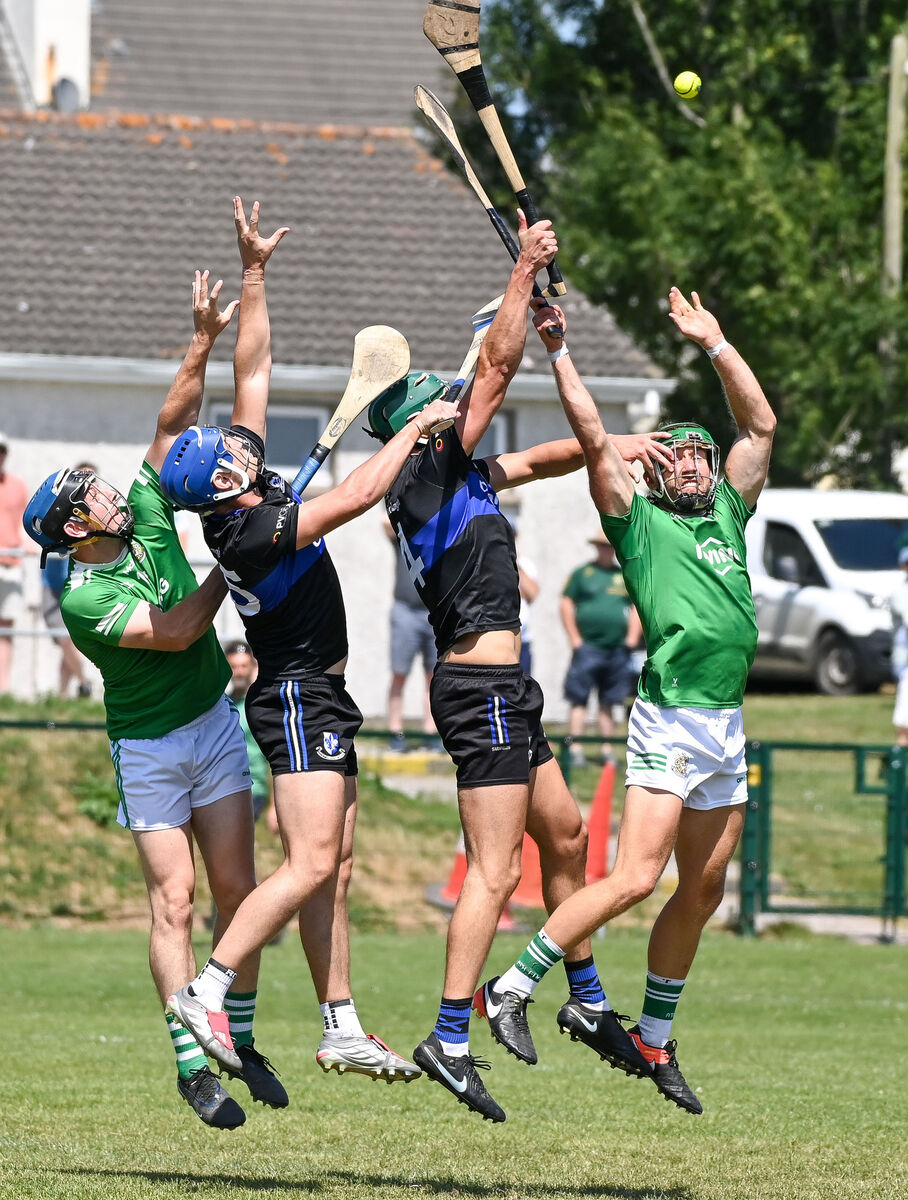 Aghada's William Leahy and John Looney battle for a dropping ball with Sarsfields' Paul Leopold and Ronan Barry. Picture: David Keane. Aghada's William Leahy and John Looney battle for a dropping ball with Sarsfields' Paul Leopold and Ronan Barry. Picture: David Keane.