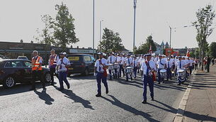 Orange parade past former Belfast flashpoint passes without incident Orange parade past former Belfast flashpoint passes without incident
